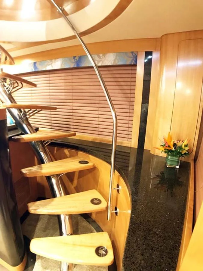 a wooden chair with a wooden frame aboard SILKY Yacht for Sale
