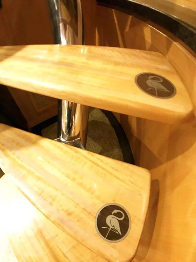 a wooden table with a metal bar aboard SILKY Yacht for Sale