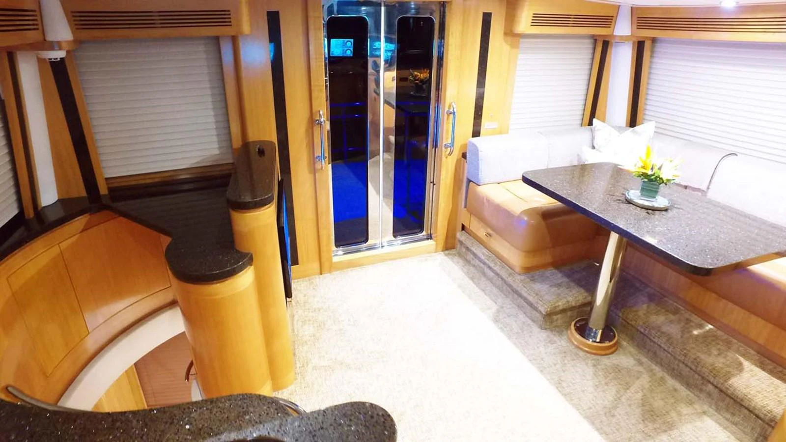 a living room with a table and couches aboard SILKY Yacht for Sale