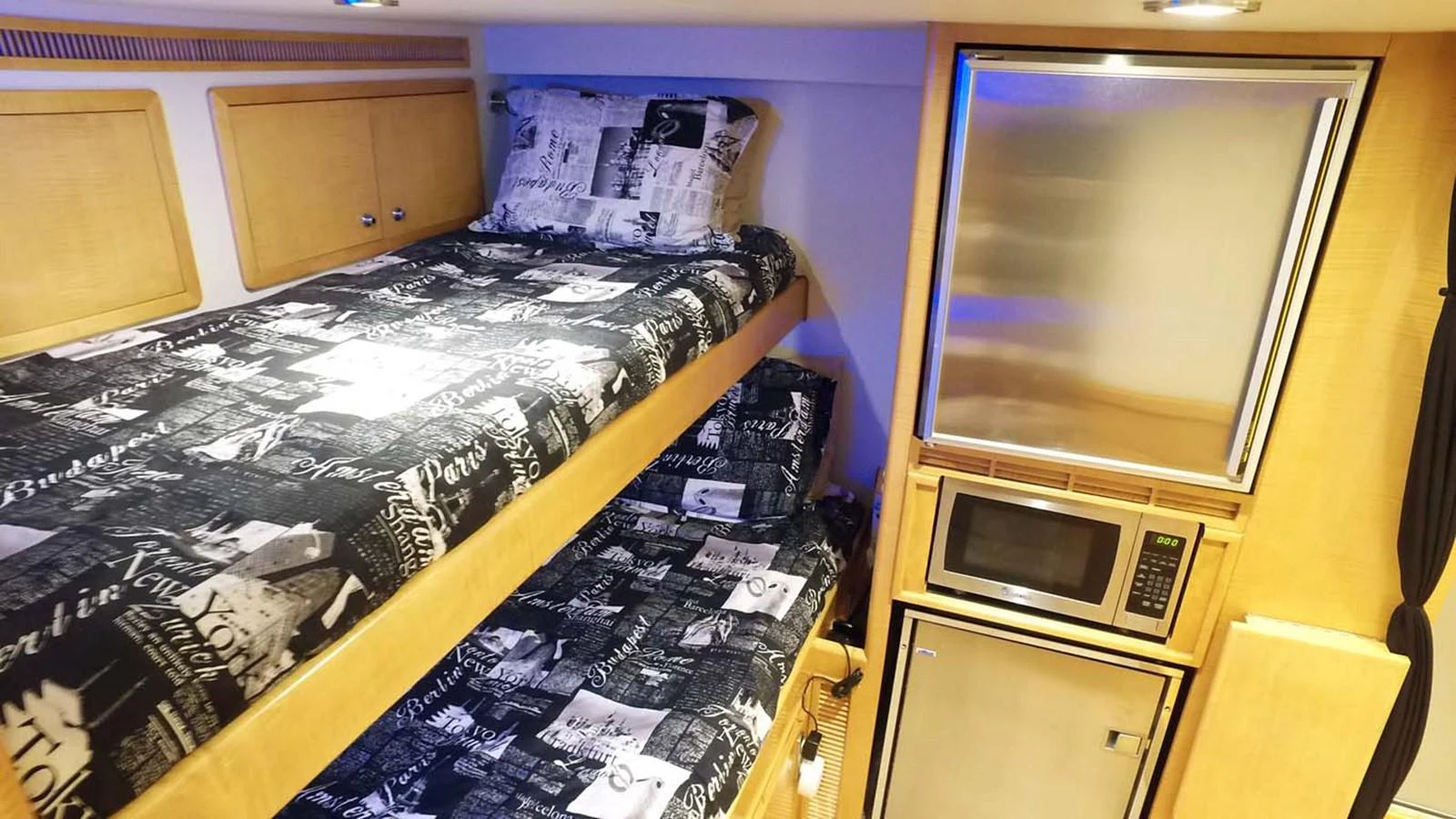 a room with a microwave and a table with papers on it aboard SILKY Yacht for Sale