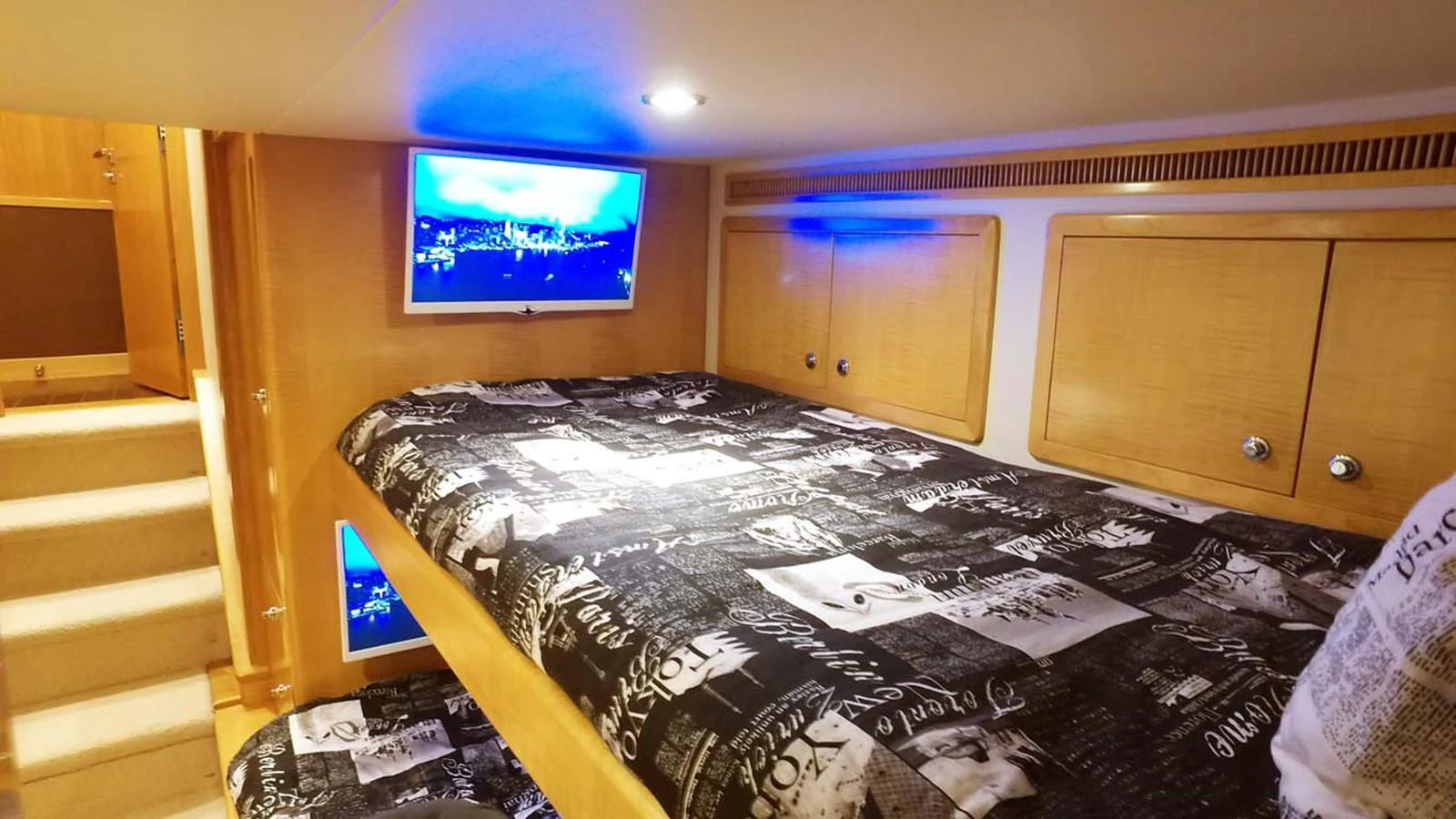 a room with a tv and cabinets aboard SILKY Yacht for Sale