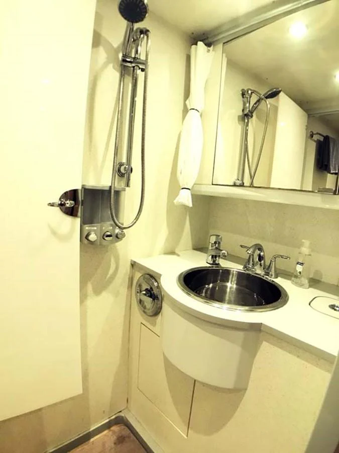 a bathroom with a sink and a mirror aboard SILKY Yacht for Sale