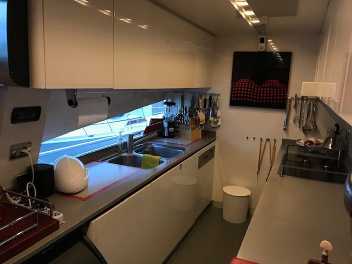 a kitchen with a sink and a counter aboard KISSES Yacht for Sale
