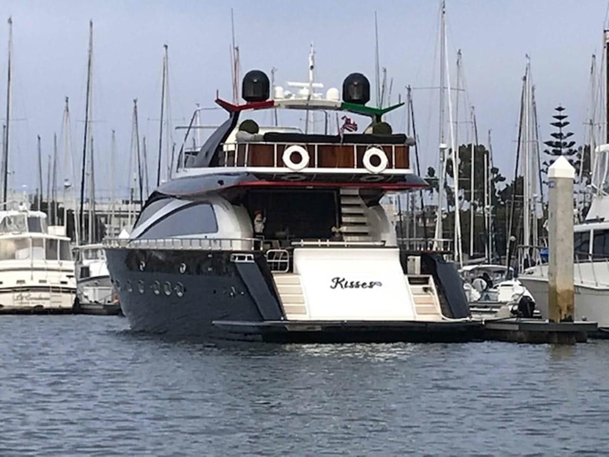a boat docked at a pier aboard KISSES Yacht for Sale