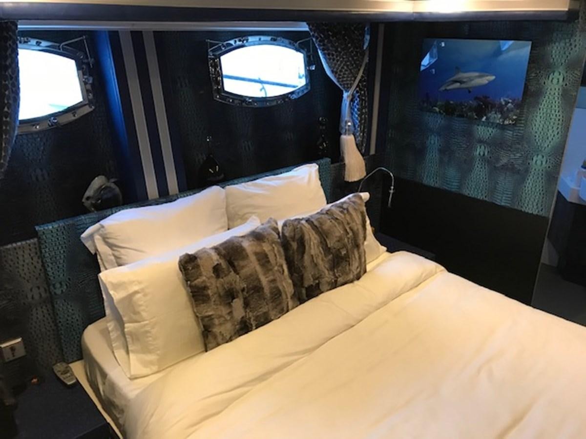 a bed in a room aboard KISSES Yacht for Sale