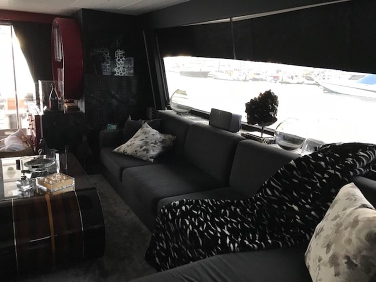 a living room with a large window aboard KISSES Yacht for Sale