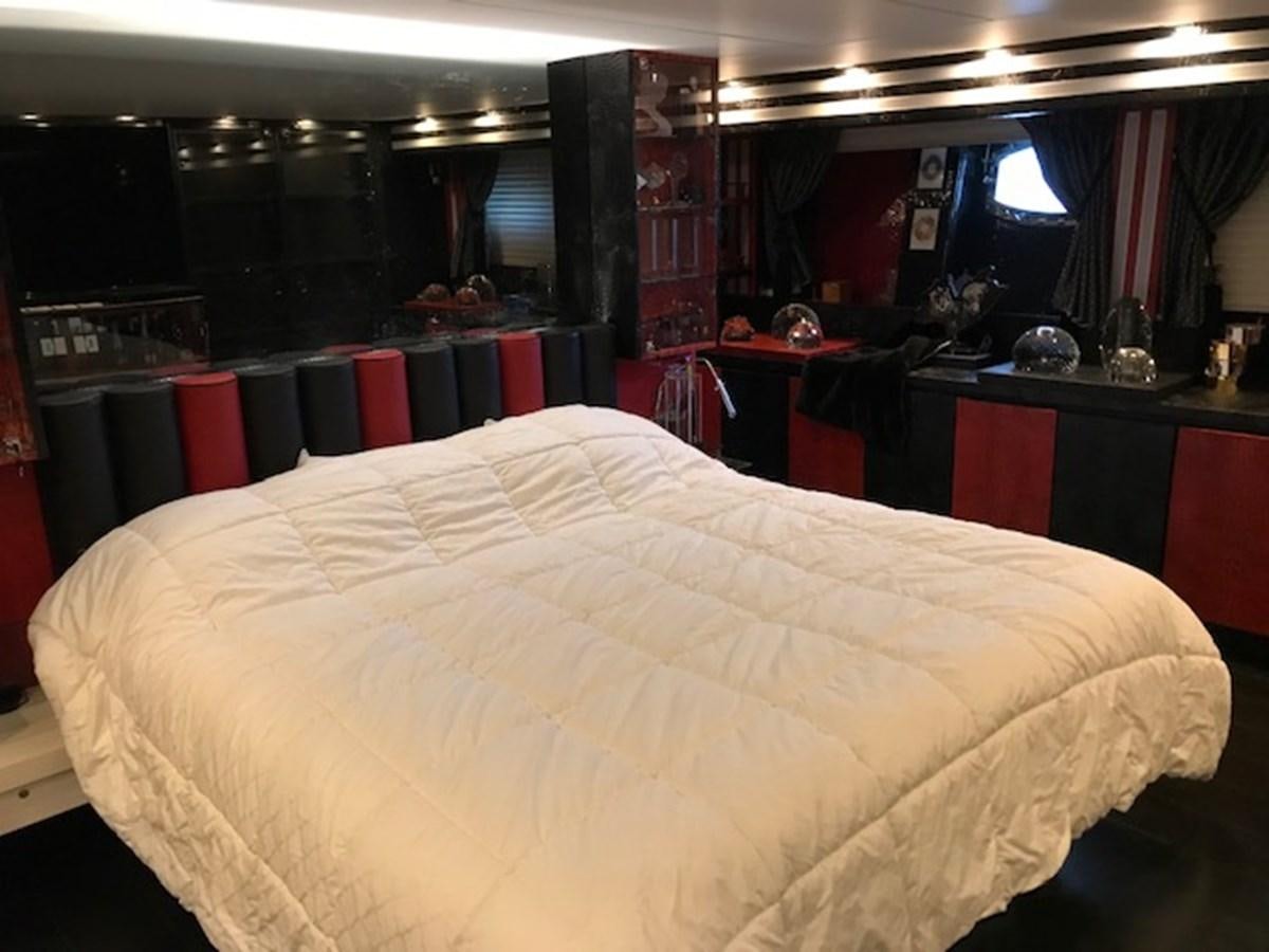a bed in a room aboard KISSES Yacht for Sale