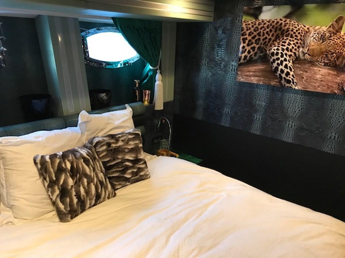 a couple of cheetahs on a bed aboard KISSES Yacht for Sale