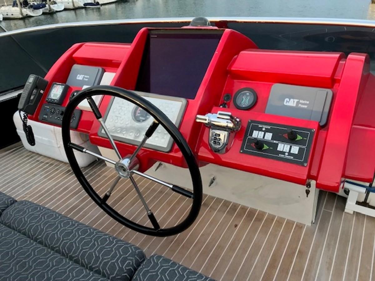 a red and black machine aboard KISSES Yacht for Sale