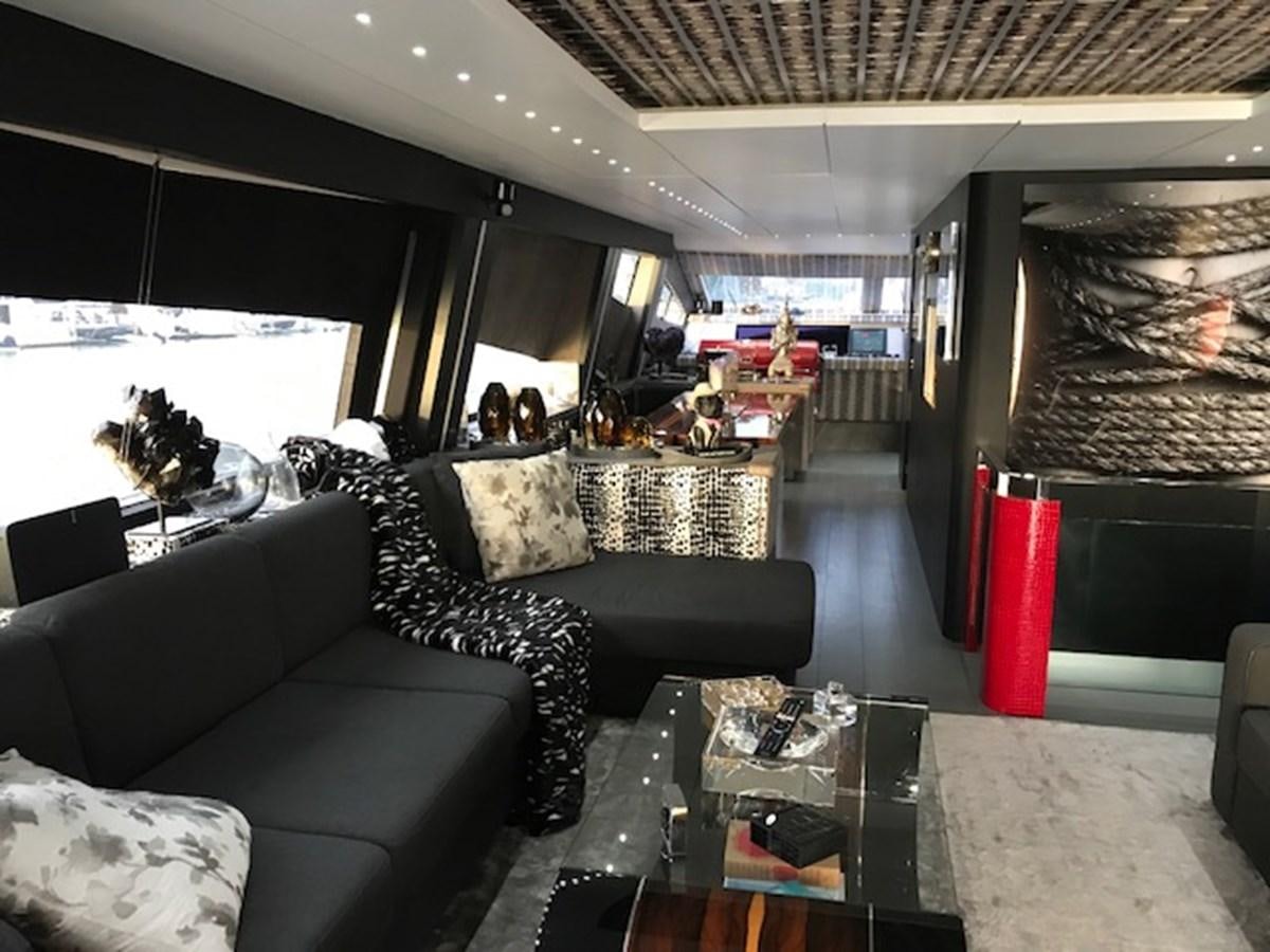 a room with couches and a table aboard KISSES Yacht for Sale