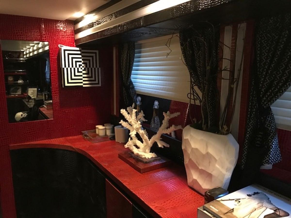 a room with a table and chairs aboard KISSES Yacht for Sale