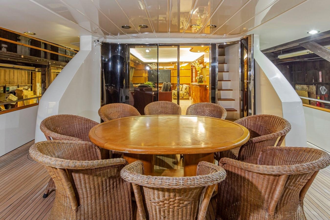 a table and chairs in a room aboard WILD WAVES Yacht for Sale