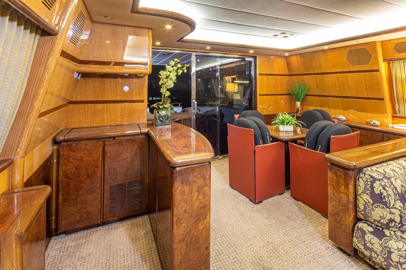 a room with a couch and a table aboard WILD WAVES Yacht for Sale