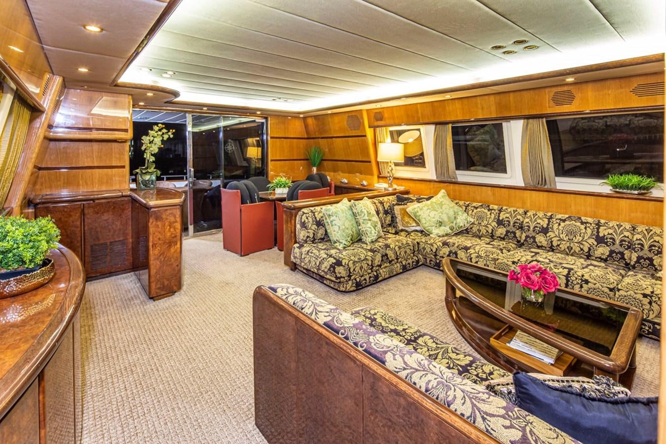 a living room with a large couch aboard WILD WAVES Yacht for Sale