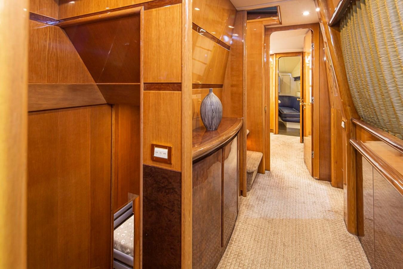 a hallway with wood cabinets aboard WILD WAVES Yacht for Sale