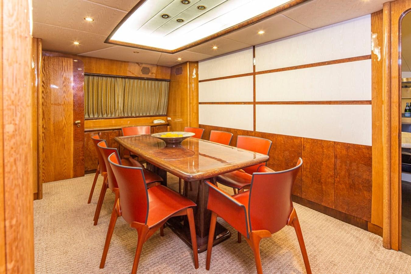 a table and chairs in a room aboard WILD WAVES Yacht for Sale