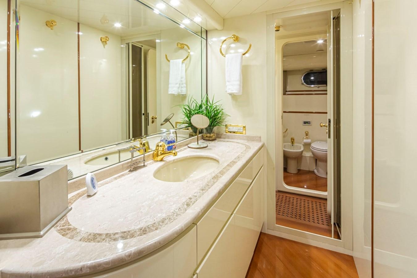 a bathroom with a large mirror aboard WILD WAVES Yacht for Sale