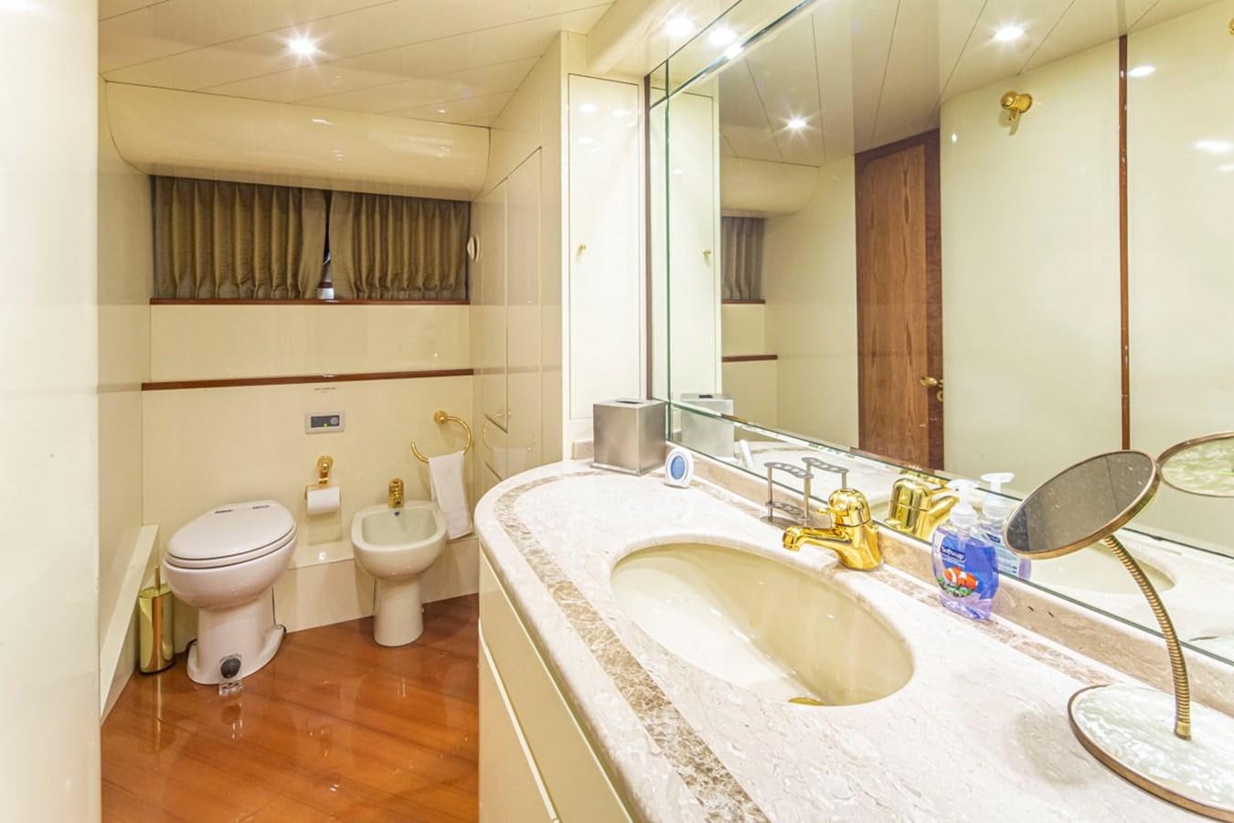 a bathroom with a sink toilet and a bathtub aboard WILD WAVES Yacht for Sale