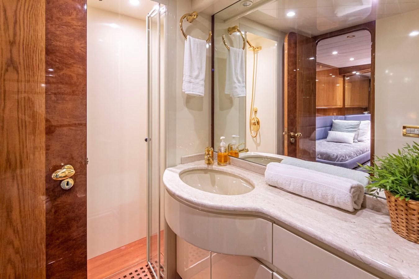 a bathroom with a large mirror aboard WILD WAVES Yacht for Sale