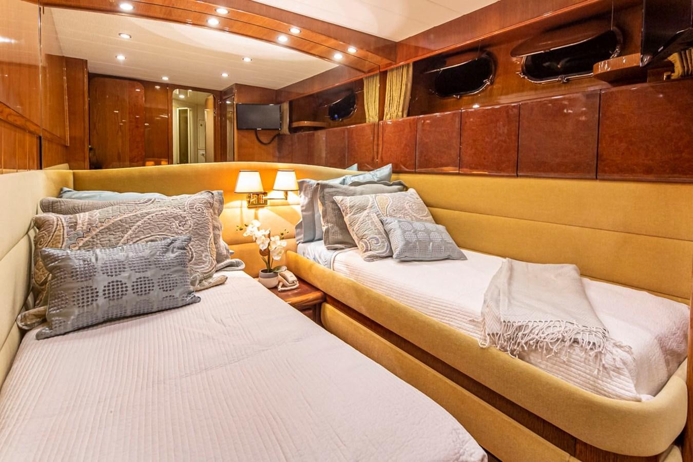 a room with two beds aboard WILD WAVES Yacht for Sale