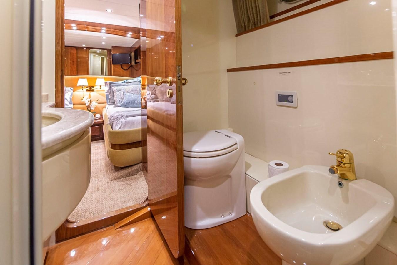 a bathroom with a sink toilet and a bathtub aboard WILD WAVES Yacht for Sale