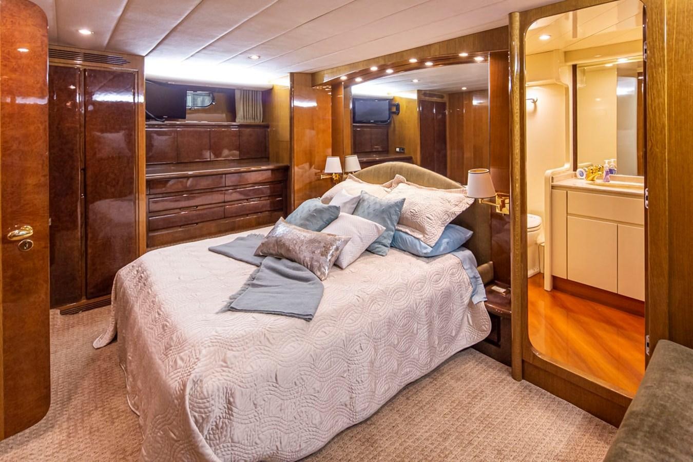 a bed in a room aboard WILD WAVES Yacht for Sale