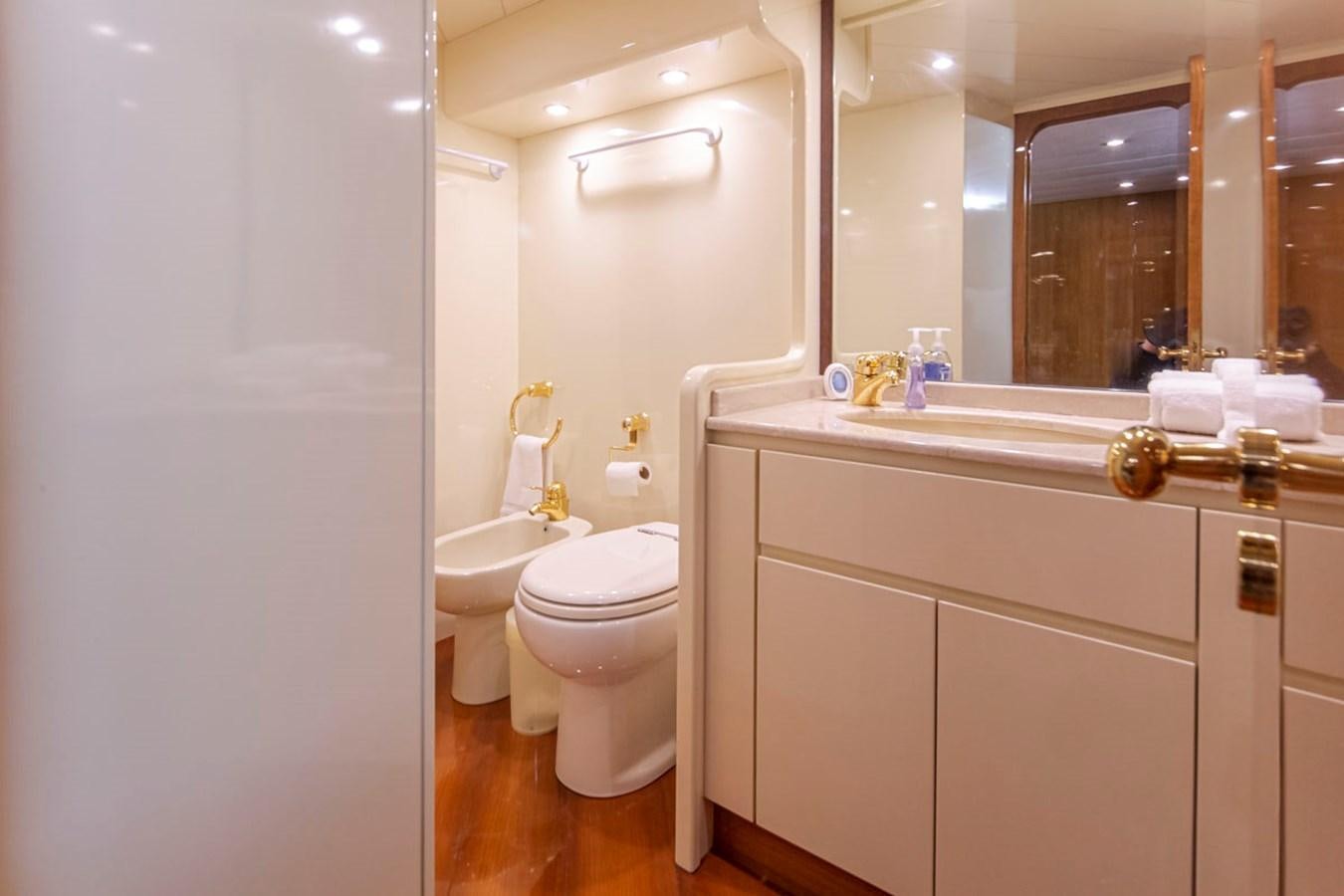 a bathroom with a large mirror aboard WILD WAVES Yacht for Sale