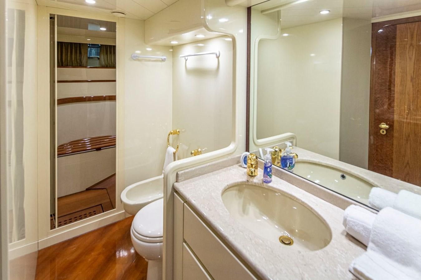 a bathroom with a sink and toilet aboard WILD WAVES Yacht for Sale