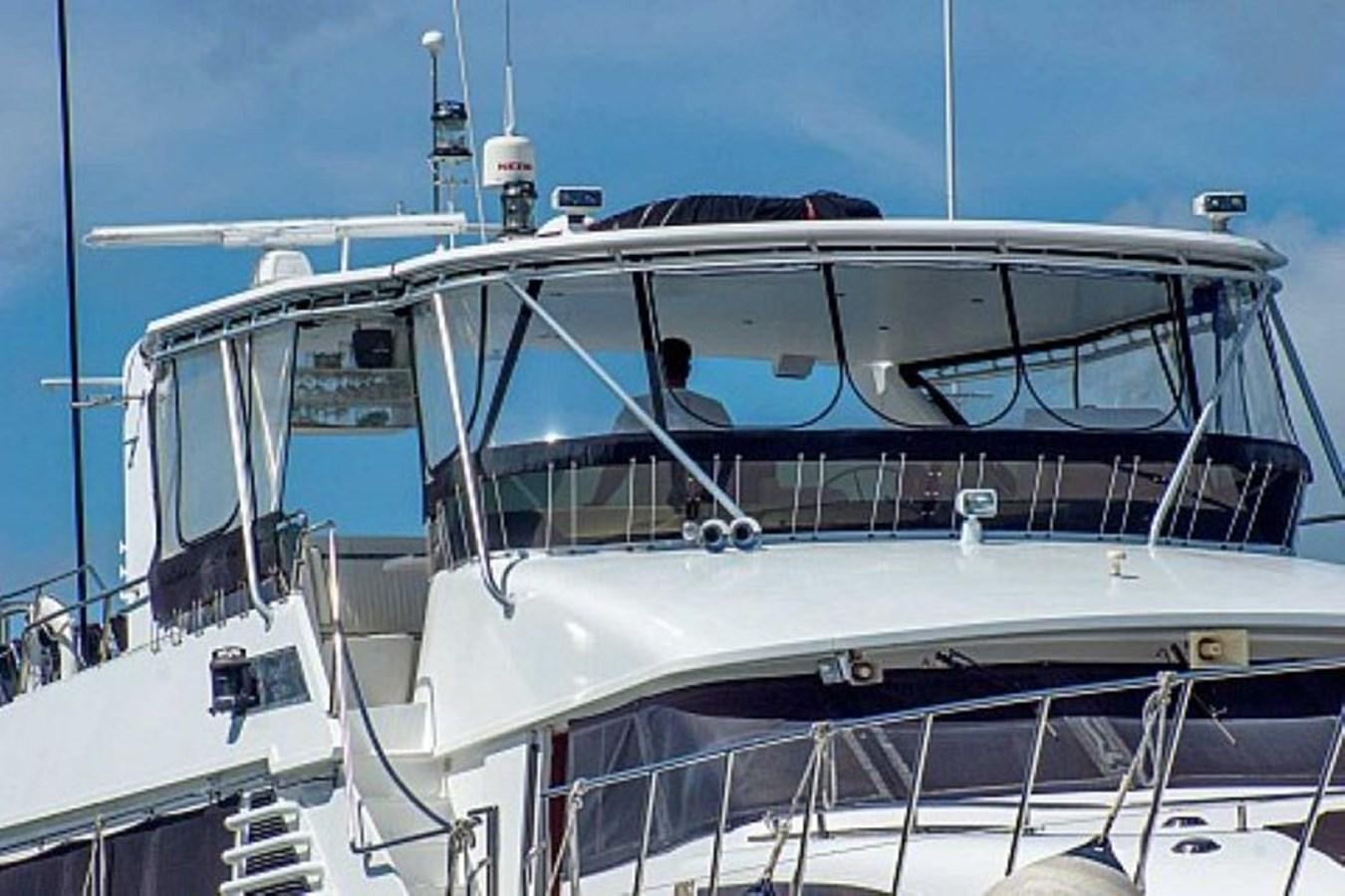 a white yacht with a person in the front aboard LADY CHARLOTTE Yacht for Sale