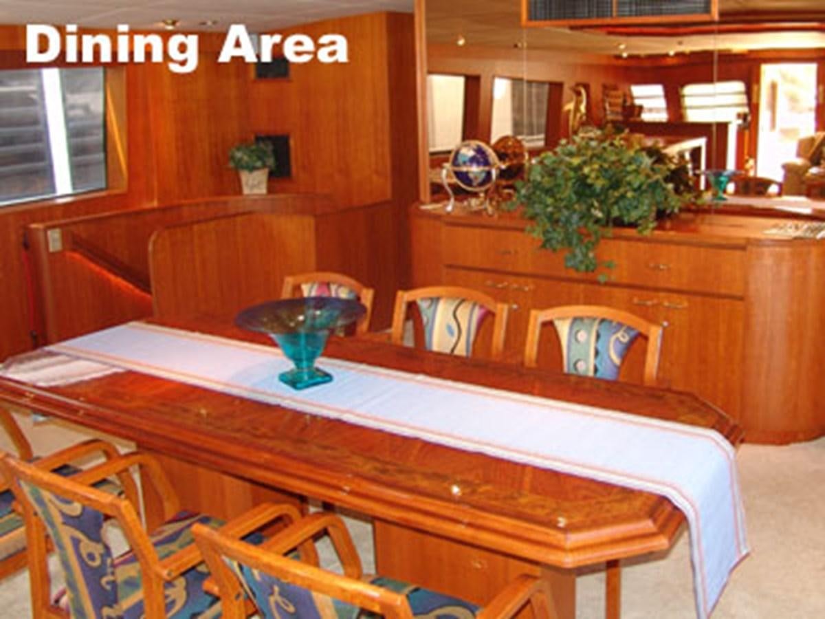 a table with a plant on it aboard LADY CHARLOTTE Yacht for Sale