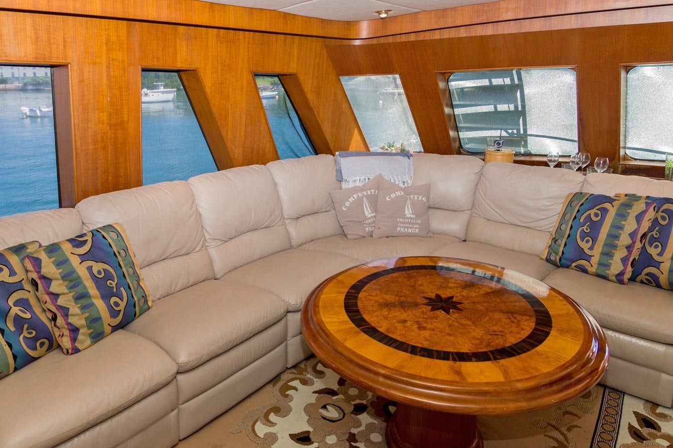 a living room with a couch and a table aboard LADY CHARLOTTE Yacht for Sale