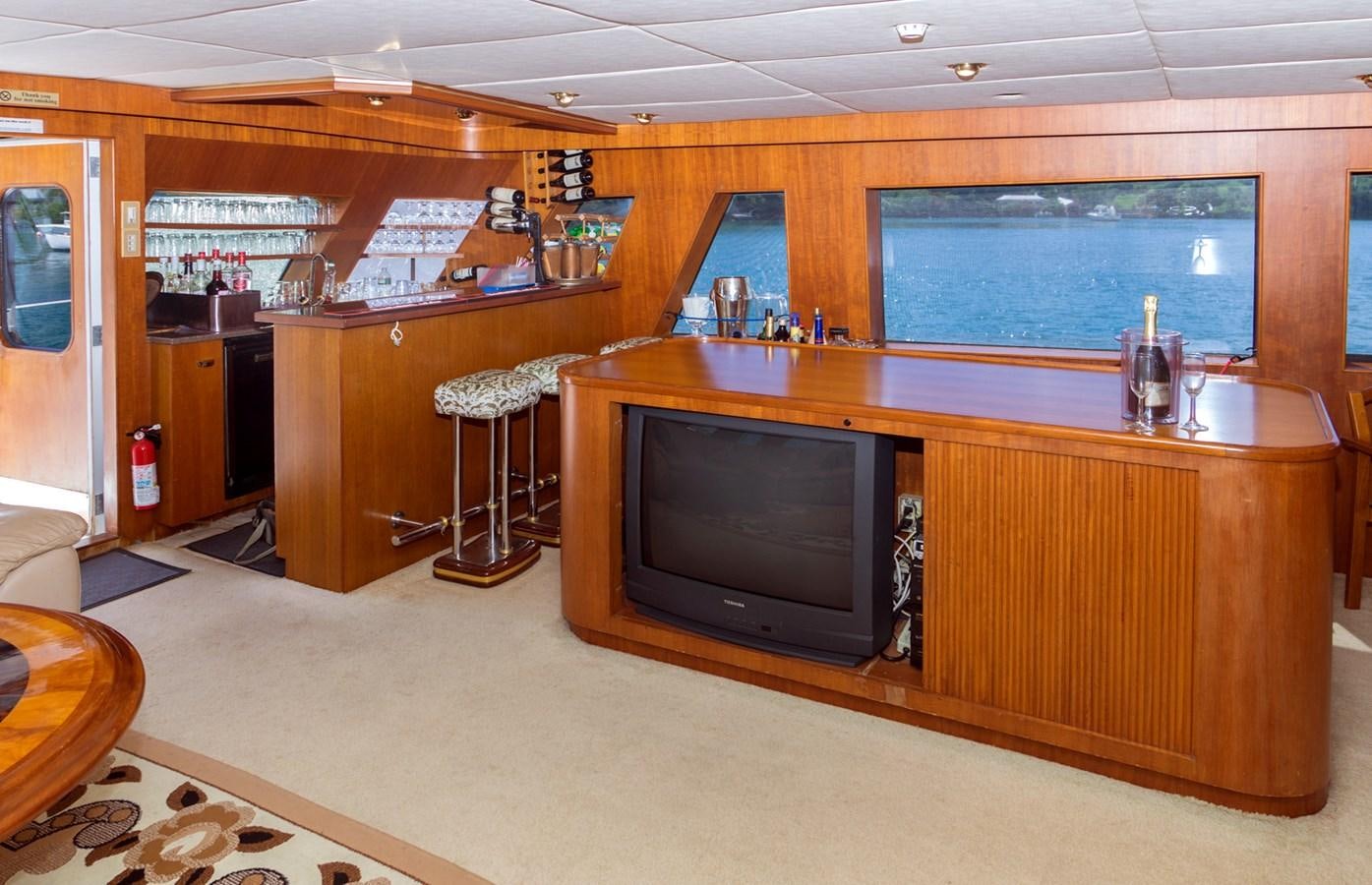 a kitchen with a tv and a microwave aboard LADY CHARLOTTE Yacht for Sale