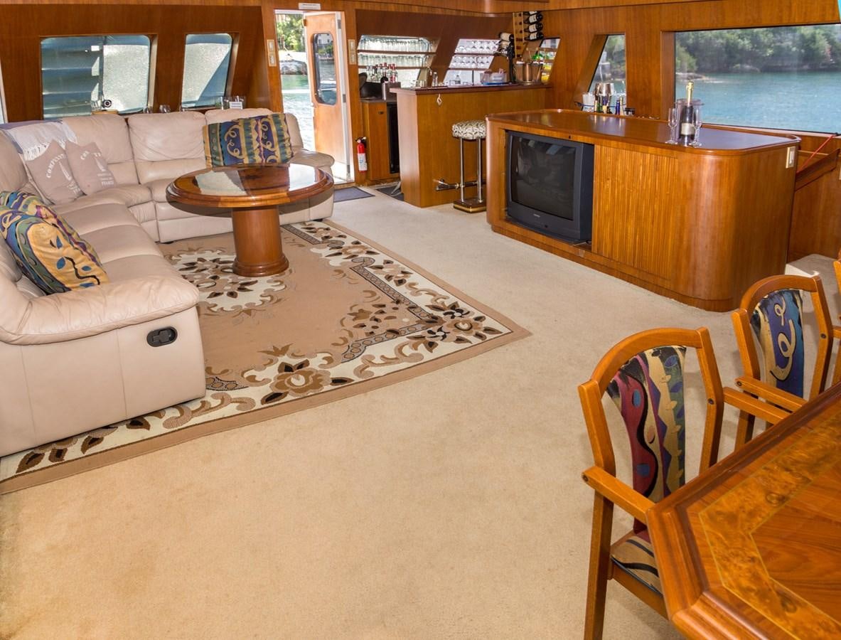 a living room with a couch and a table aboard LADY CHARLOTTE Yacht for Sale