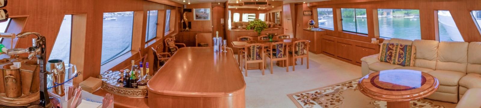 a living room with a table and chairs aboard LADY CHARLOTTE Yacht for Sale