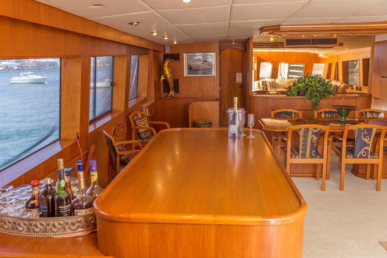 a bar with a table and chairs aboard LADY CHARLOTTE Yacht for Sale