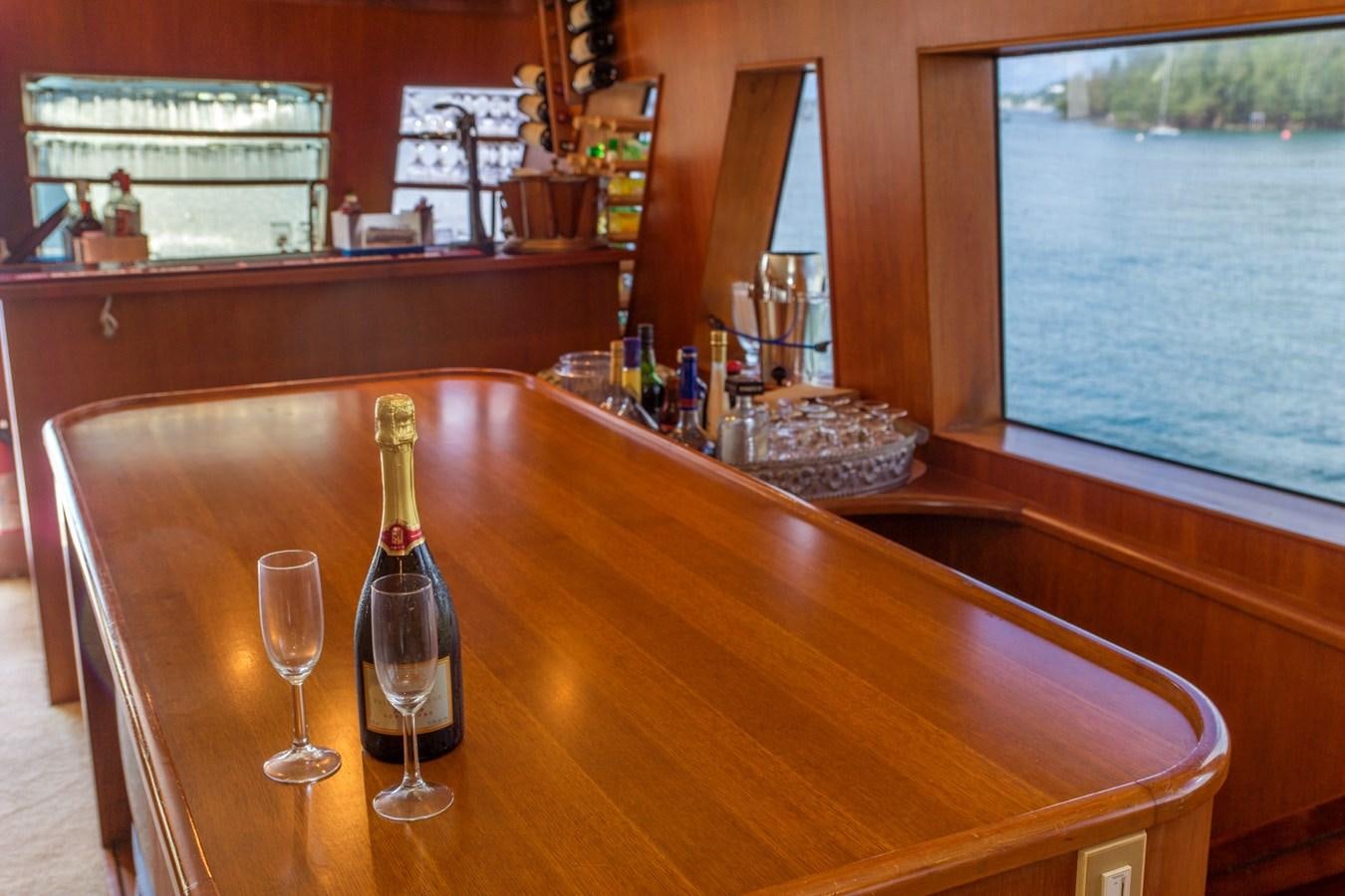 a wine glass on a table aboard LADY CHARLOTTE Yacht for Sale