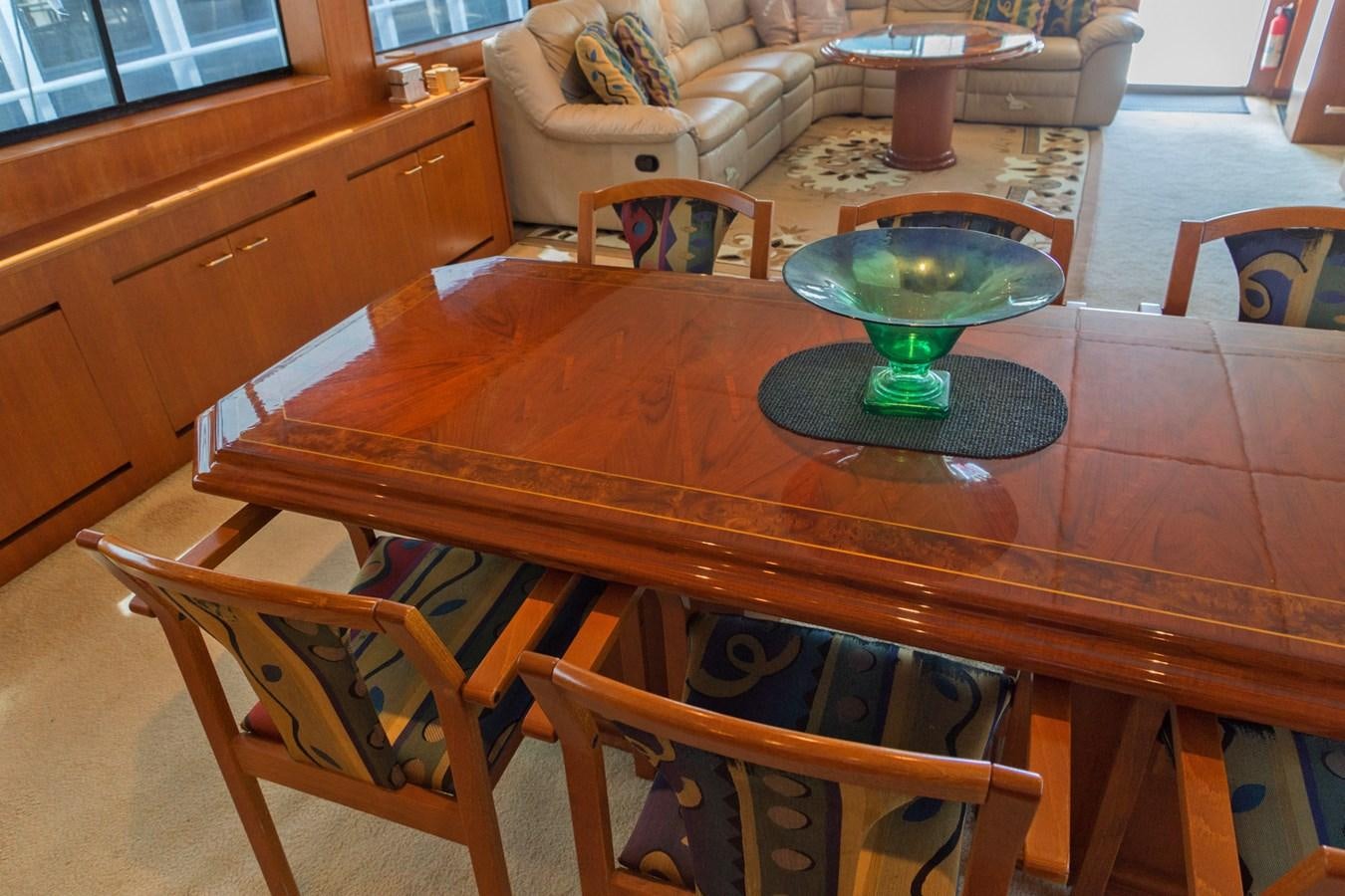 a table with chairs around it aboard LADY CHARLOTTE Yacht for Sale