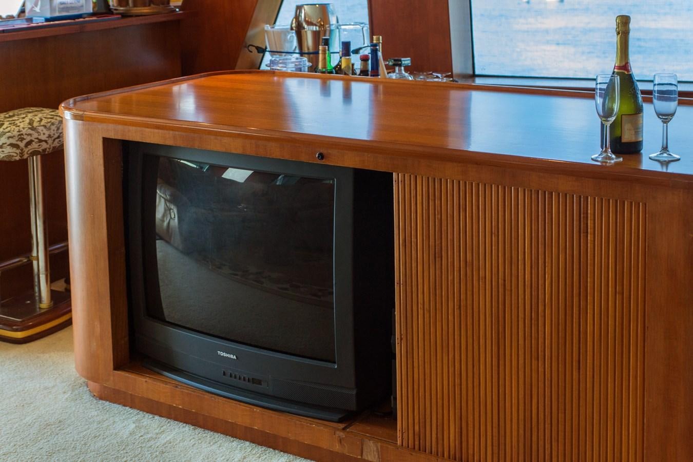 a television on a table aboard LADY CHARLOTTE Yacht for Sale