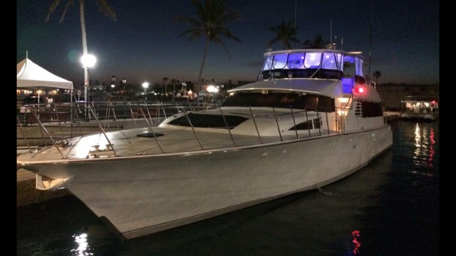 a large yacht at night aboard LADY CHARLOTTE Yacht for Sale