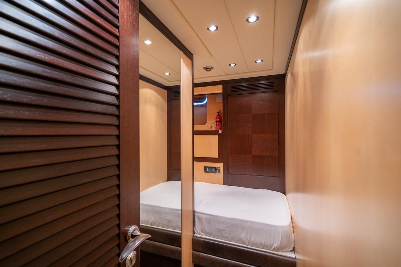 a bed in a room aboard FIVE STARS Yacht for Sale