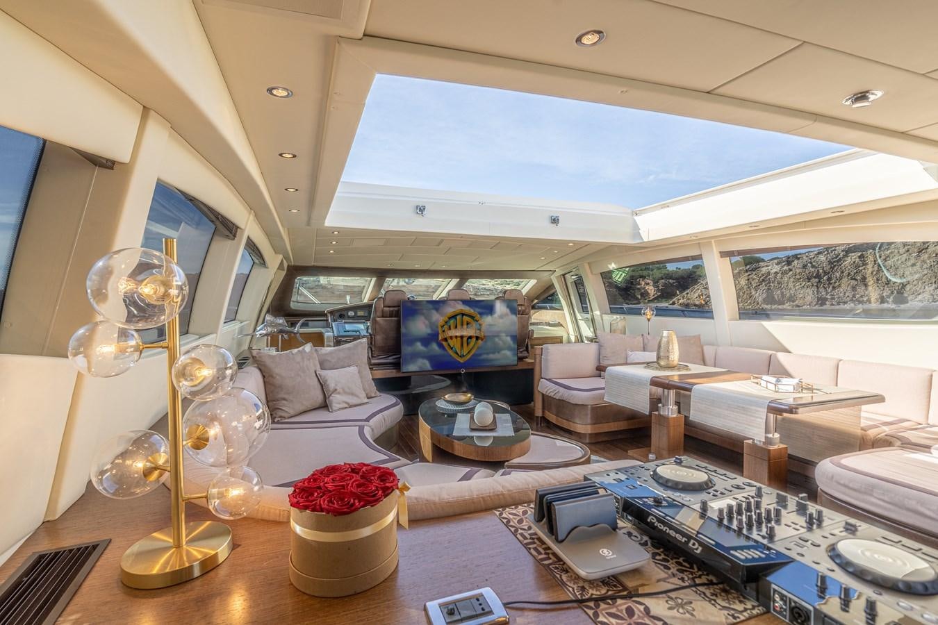 a living room with a large window aboard FIVE STARS Yacht for Sale