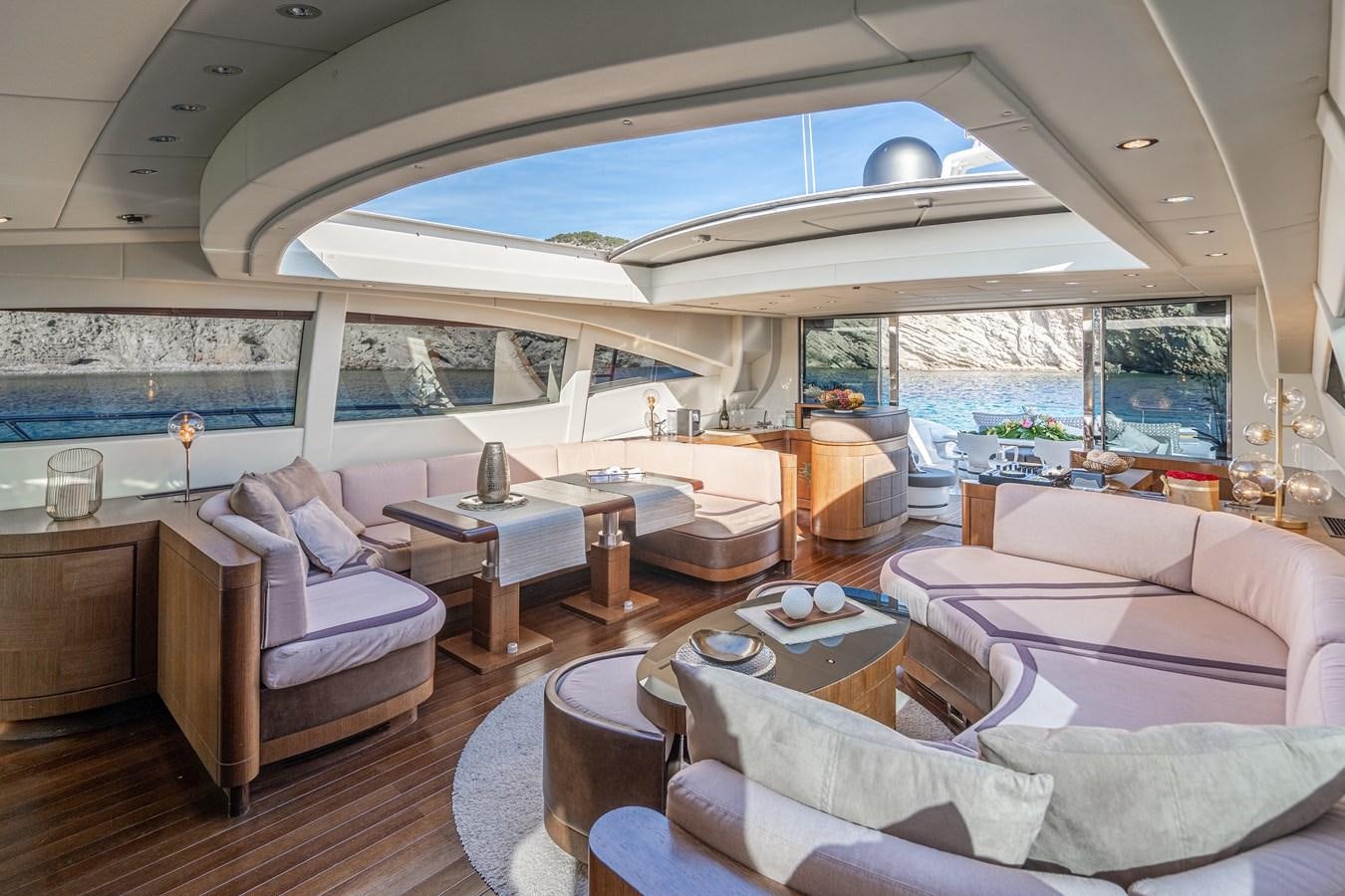 a living room with a large window aboard FIVE STARS Yacht for Sale