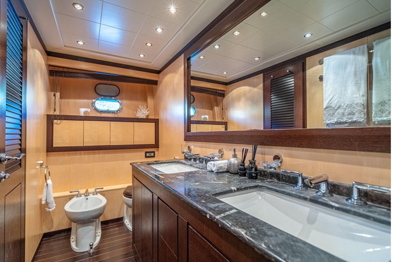 a bathroom with a sink and a toilet aboard FIVE STARS Yacht for Sale