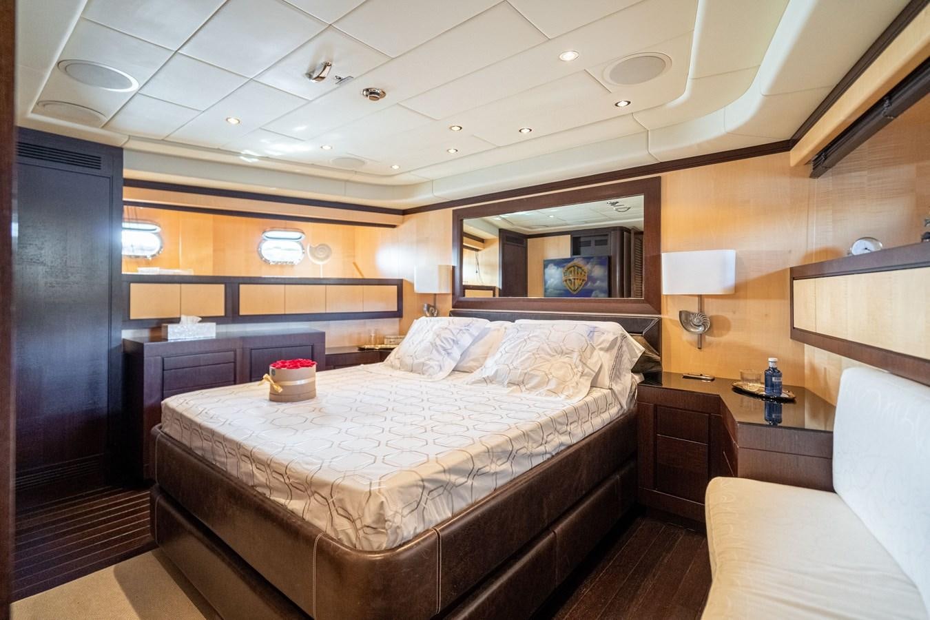 a room with a bed and a couch aboard FIVE STARS Yacht for Sale
