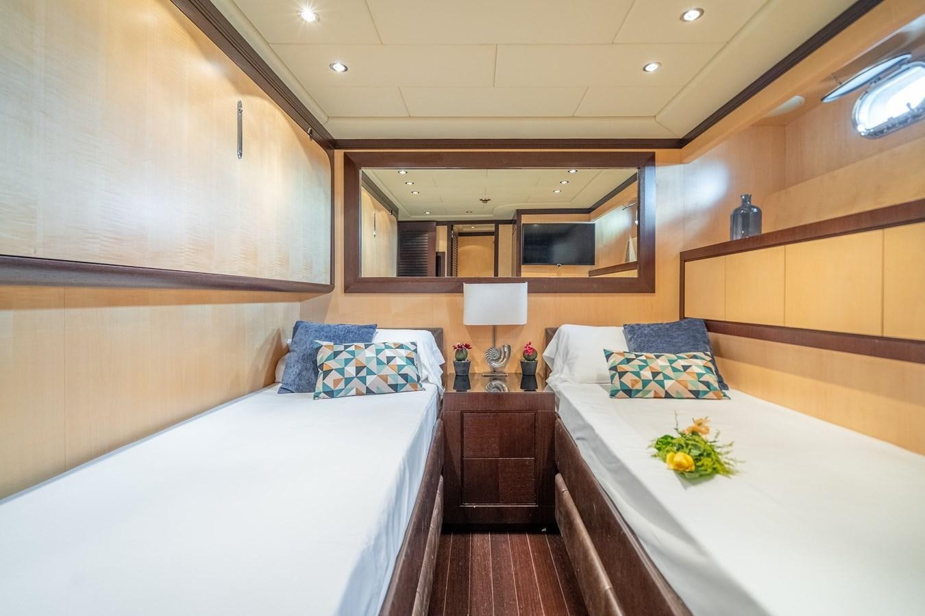 a room with two beds aboard FIVE STARS Yacht for Sale