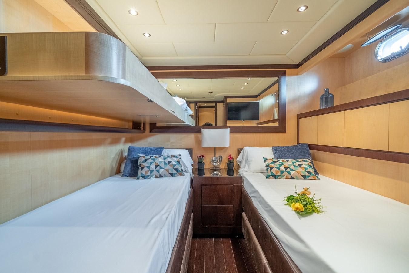 a room with two beds aboard FIVE STARS Yacht for Sale