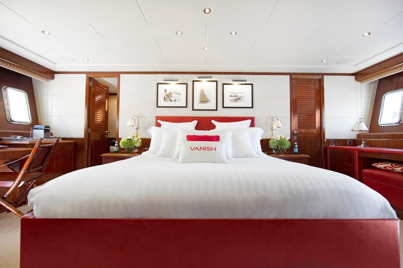 a large bed in a hotel room aboard VANISH Yacht for Sale