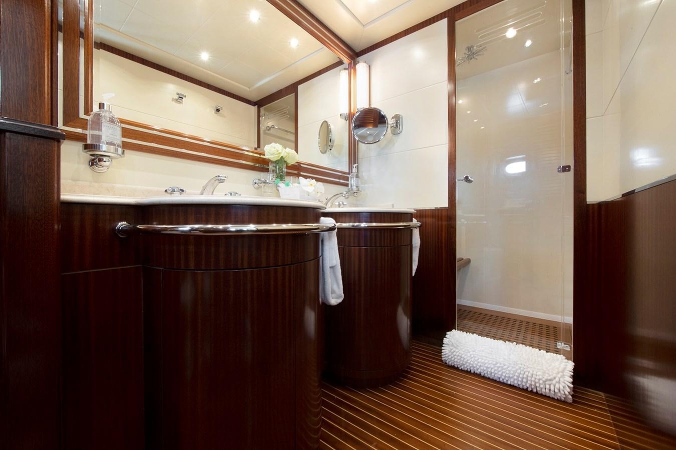 a bathroom with a sink and a mirror aboard VANISH Yacht for Sale