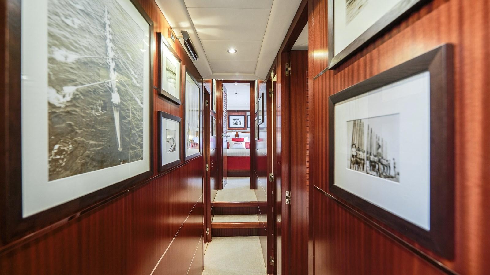 a hallway with red doors aboard VANISH Yacht for Sale