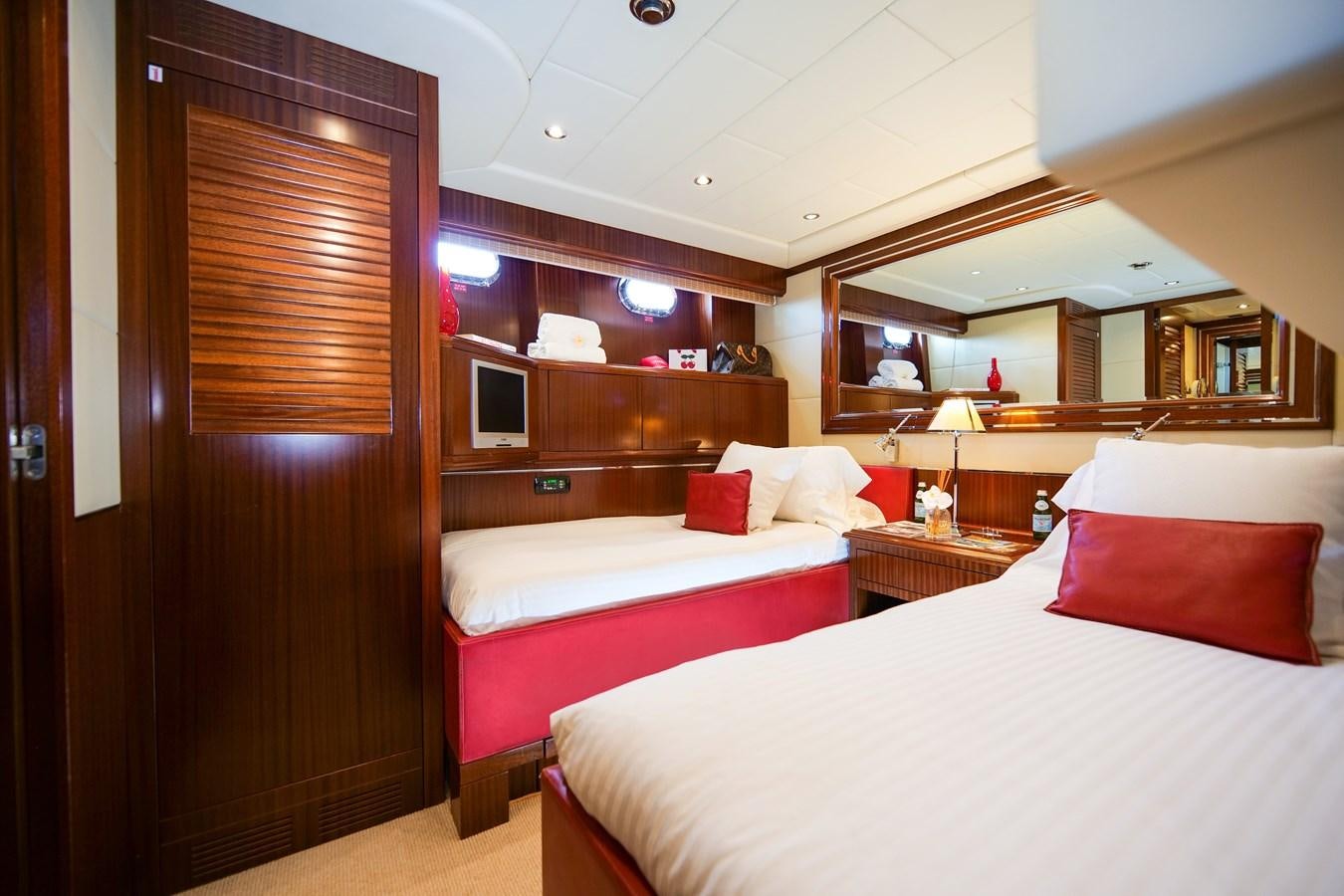 a room with two beds aboard VANISH Yacht for Sale